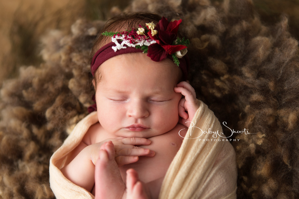 Newborn baby girl in flower headband