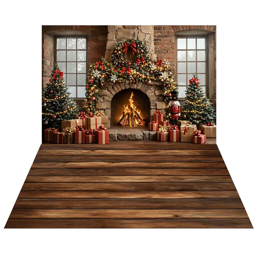 A decorated fireplace with a lit fire, flanked by Christmas trees and gifts—perfect for kids Christmas portraits or your next xmas mini sessions—set against a brick wall with large windows and a wooden floor.
