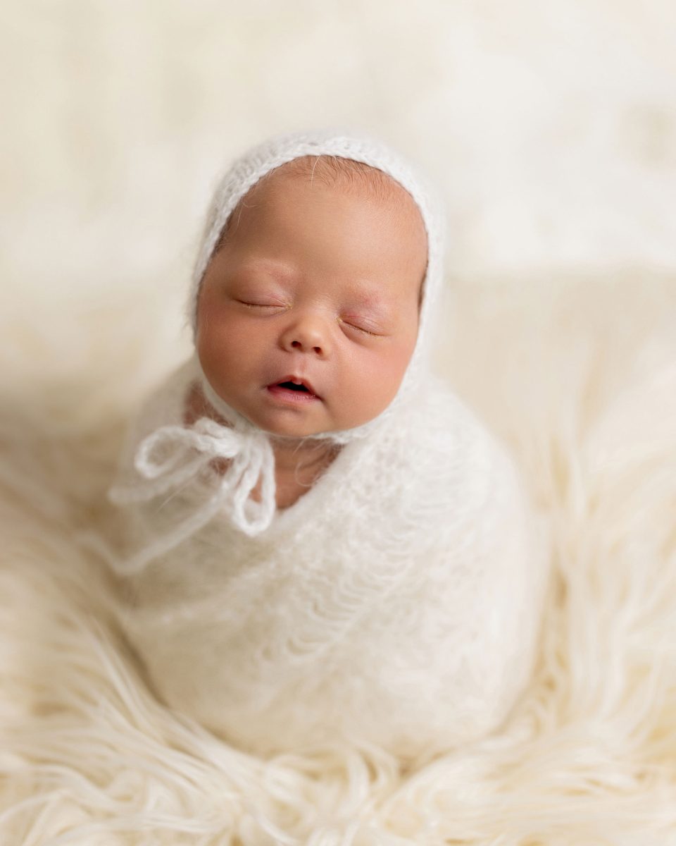 Baby photographer serving Three Bridges and Crawley, capturing a newborn baby in a natural, minimalist style.