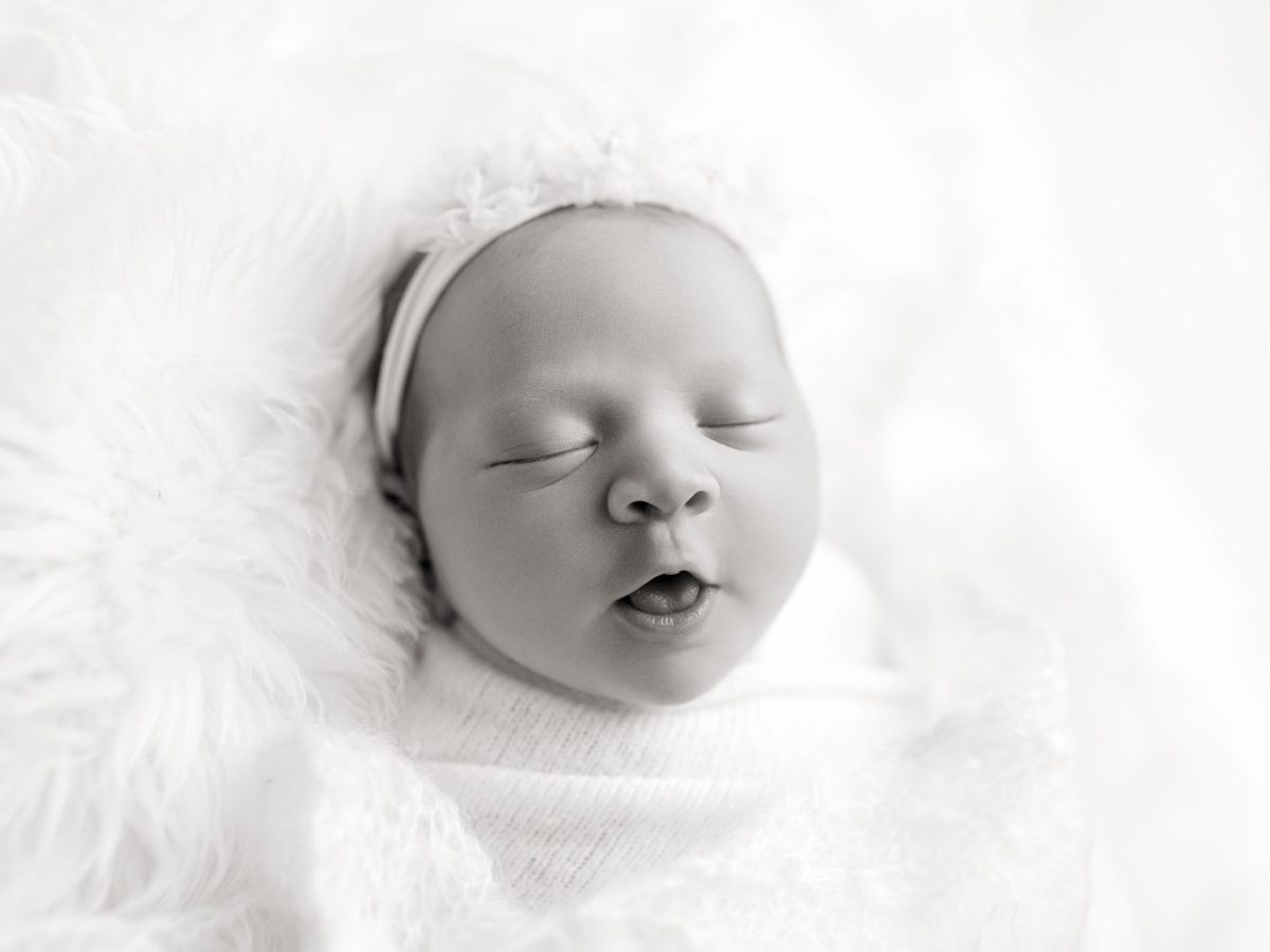 Simple newborn portraits for parents in Turners Hill in Sussex.