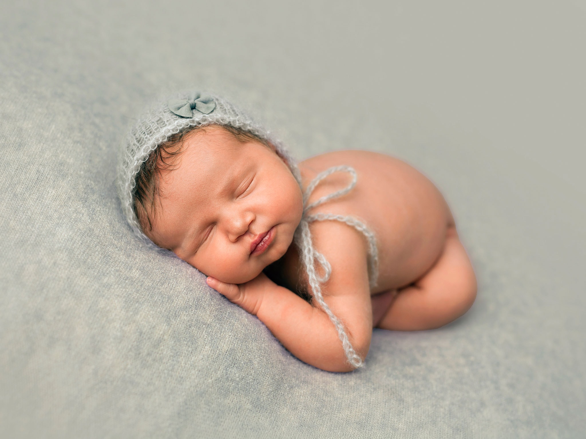 Safe, beautiful newborn photography session with baby-led posing in Sussex studio