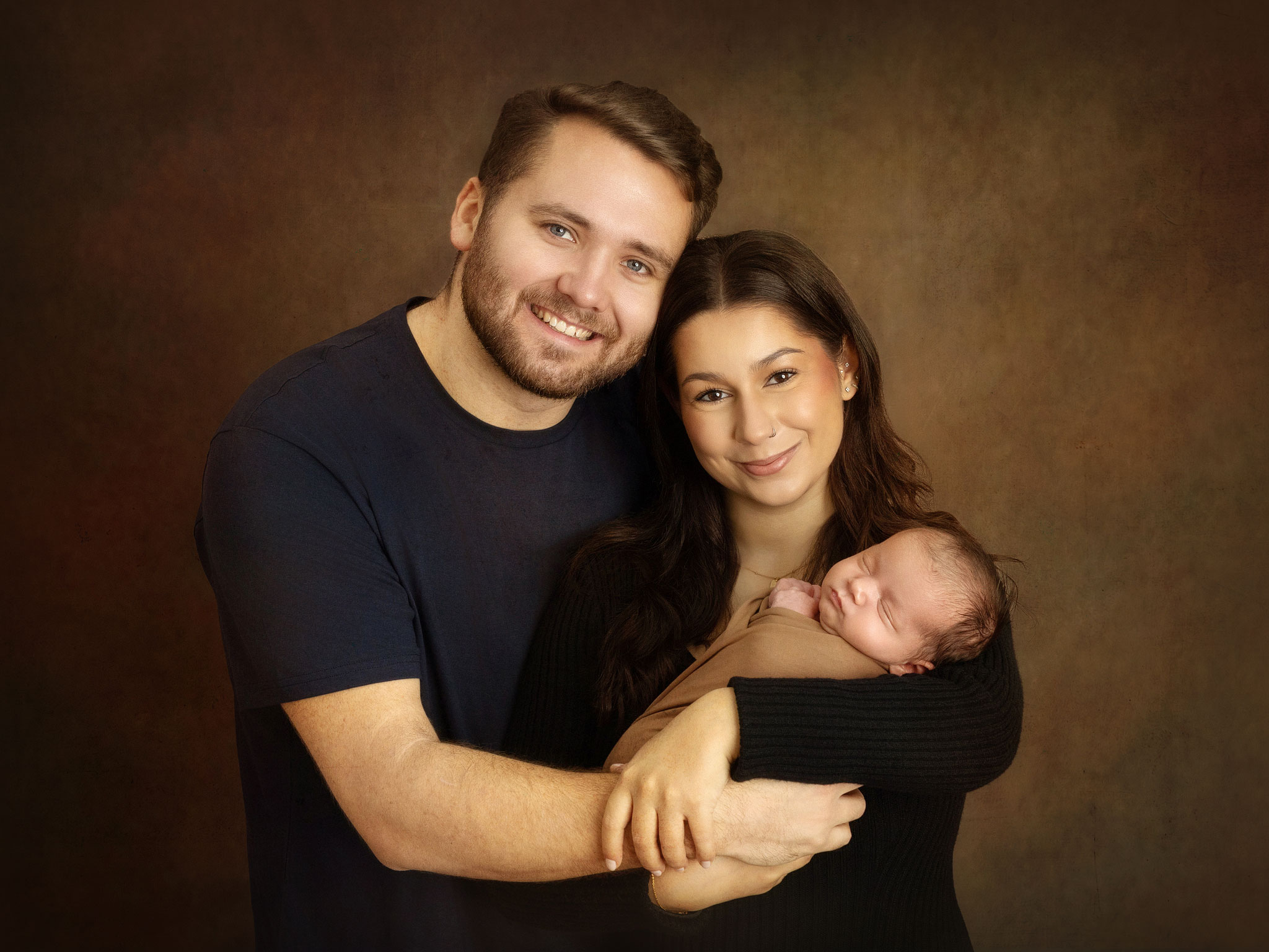 Simple but classic newborn portraits with parents in our Sussex studio